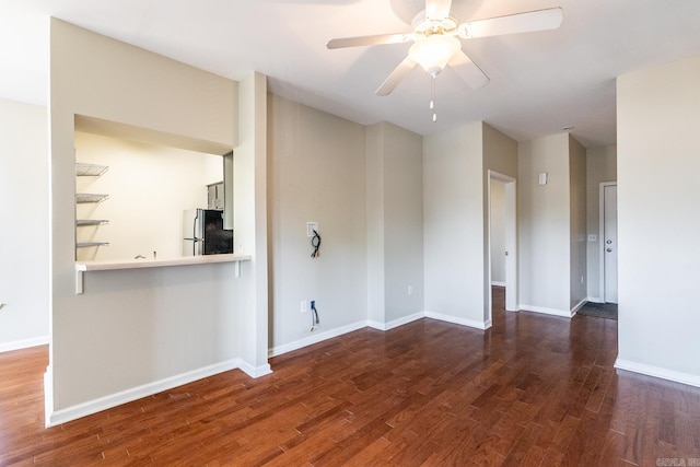 820 N St, Little Rock, AR 72201 - unfurnished living room with ceiling fan, wood finished floors, and baseboards