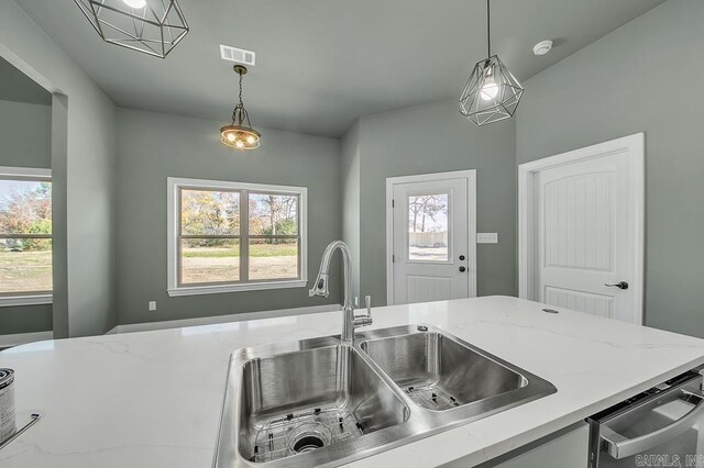 kitchen with a sink, visible vents, stainless steel dishwasher, and a healthy amount of sunlight
