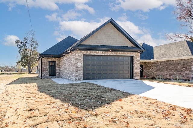 single story home with brick siding, roof with shingles, a garage, and concrete driveway
