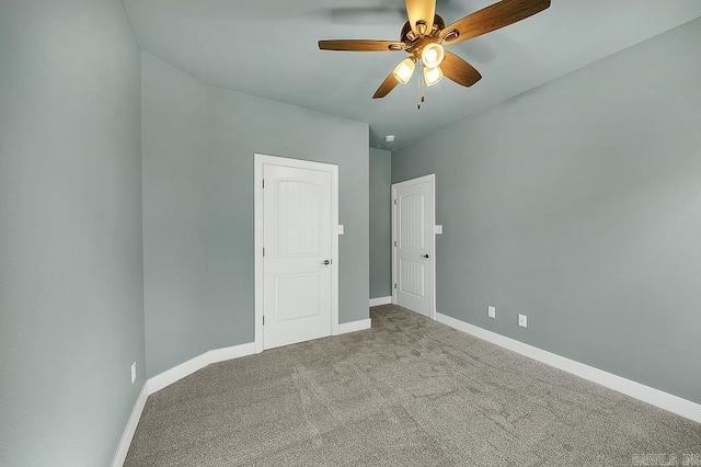 unfurnished bedroom with carpet, baseboards, and ceiling fan