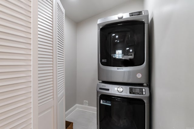 6723 Greenwood, Little Rock, AR 72207 - laundry area featuring baseboards and stacked washer / drying machine