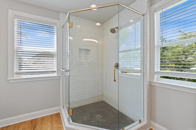 6723 Greenwood, Little Rock, AR 72207 - bathroom with baseboards, a wealth of natural light, and a stall shower