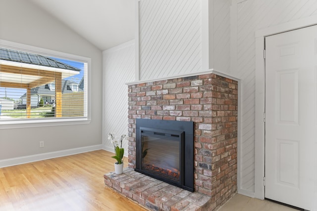 6723 Greenwood, Little Rock, AR 72207 - details featuring a brick fireplace, baseboards, and wood finished floors