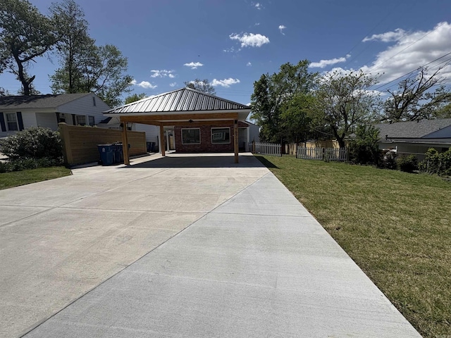 6723 Greenwood, Little Rock, AR 72207 - view of front of house with fence, a carport, concrete driveway, and a front yard