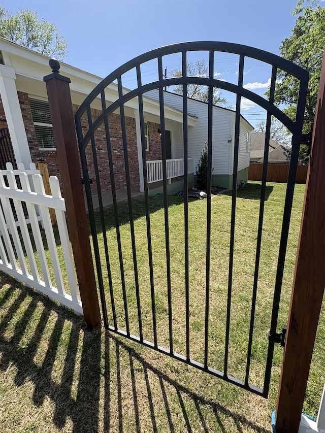 6723 Greenwood, Little Rock, AR 72207 - view of gate with a yard and fence private yard