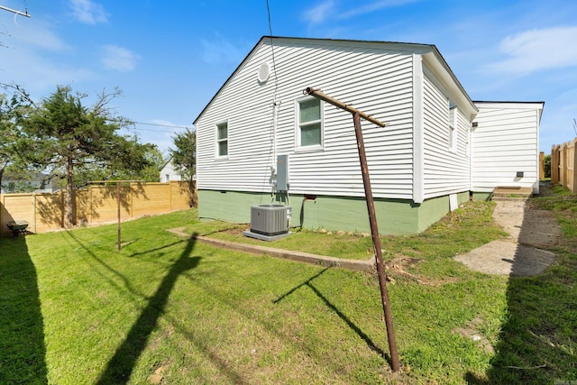 6723 Greenwood, Little Rock, AR 72207 - view of side of home featuring a lawn, fence, crawl space, and cooling unit