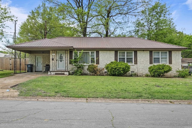 single story home featuring a carport, metal roof, fence, a front lawn, and driveway