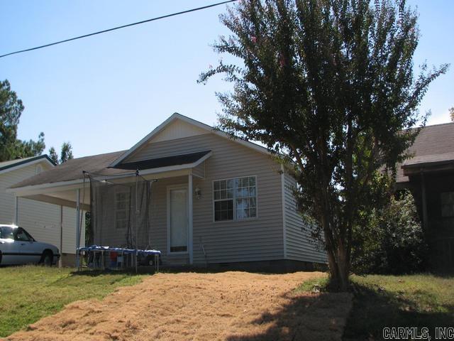 bungalow with crawl space, a front yard, and a trampoline