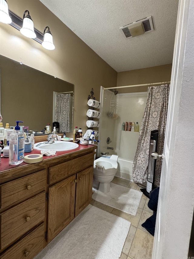 bathroom with shower / bath combination with curtain, toilet, vanity, visible vents, and a textured ceiling
