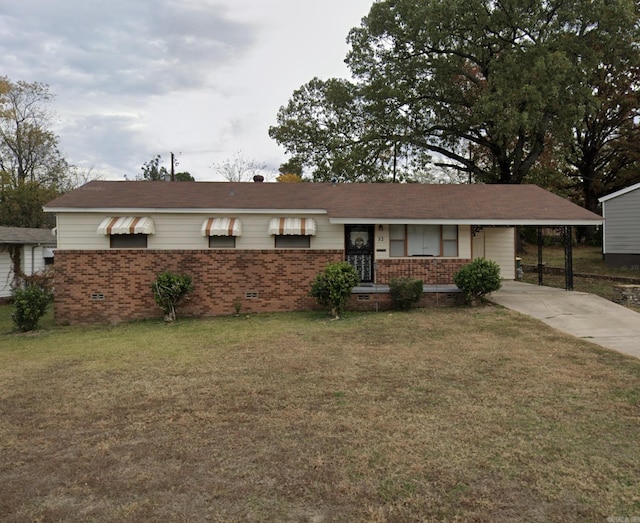ranch-style house with crawl space, a carport, a front lawn, brick siding, and concrete driveway