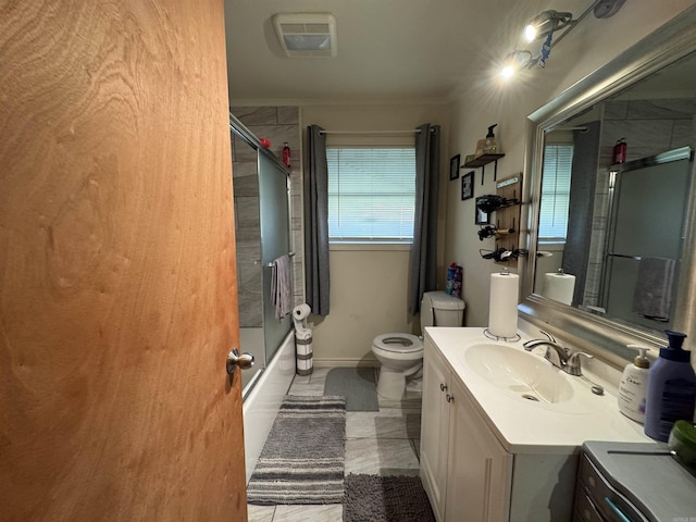 full bathroom with vanity, baseboards, shower / washtub combination, toilet, and visible vents