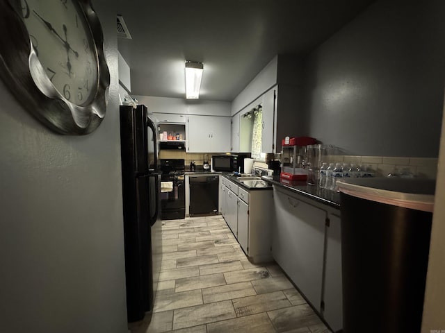 kitchen featuring white cabinetry, open shelves, dark countertops, visible vents, and black appliances