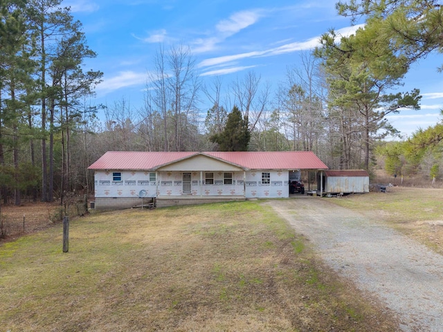 580 Providence Loop, Malvern, AR 72104 - single story home featuring a porch, metal roof, driveway, and a front lawn