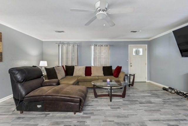 580 Providence Loop, Malvern, AR 72104 - living room with crown molding, wood finished floors, baseboards, and visible vents
