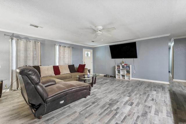 580 Providence Loop, Malvern, AR 72104 - living area featuring visible vents, baseboards, ceiling fan, crown molding, and wood finished floors