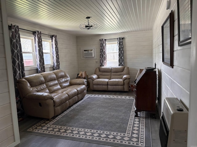 living room featuring wooden walls, an AC wall unit, wood finished floors, and wood ceiling