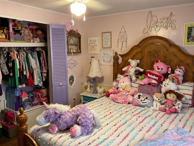 bedroom with a ceiling fan, a closet, and ornamental molding