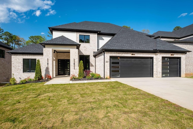 221 Abington Cir, Little Rock, AR 72223 - prairie-style house featuring concrete driveway, roof with shingles, a front yard, brick siding, and a garage