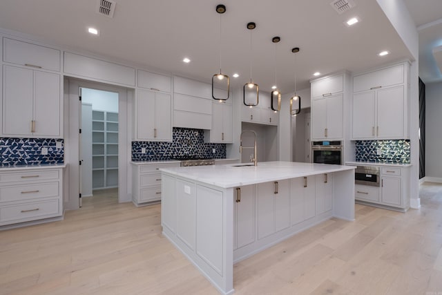 221 Abington Cir, Little Rock, AR 72223 - kitchen with a sink, visible vents, backsplash, and appliances with stainless steel finishes