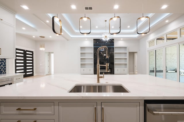 221 Abington Cir, Little Rock, AR 72223 - kitchen with a raised ceiling, visible vents, a sink, open floor plan, and a center island with sink