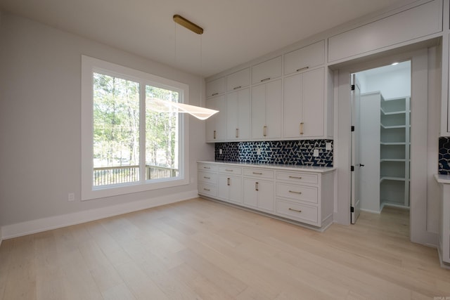 221 Abington Cir, Little Rock, AR 72223 - kitchen featuring tasteful backsplash, white cabinetry, and light wood-style floors