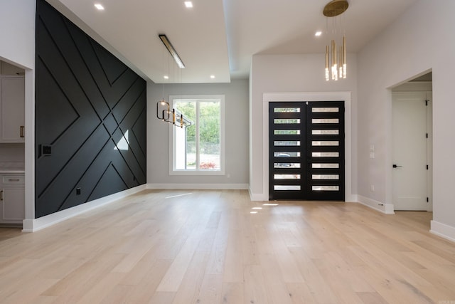 221 Abington Cir, Little Rock, AR 72223 - entrance foyer with a chandelier, light wood-style floors, and baseboards