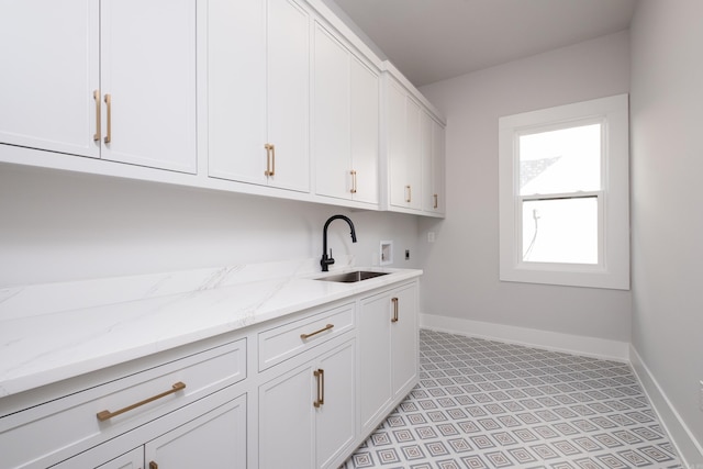 221 Abington Cir, Little Rock, AR 72223 - laundry area with baseboards, washer hookup, a sink, cabinet space, and electric dryer hookup