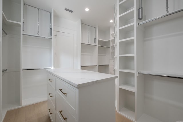221 Abington Cir, Little Rock, AR 72223 - spacious closet featuring light wood finished floors and visible vents