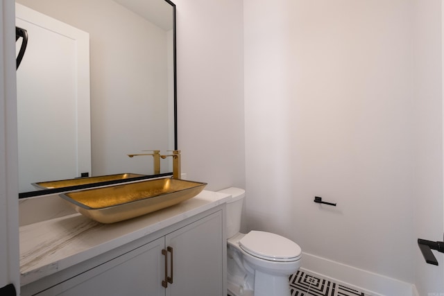 221 Abington Cir, Little Rock, AR 72223 - half bathroom featuring toilet, vanity, and visible vents