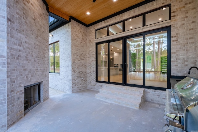 221 Abington Cir, Little Rock, AR 72223 - property entrance featuring brick siding and a patio