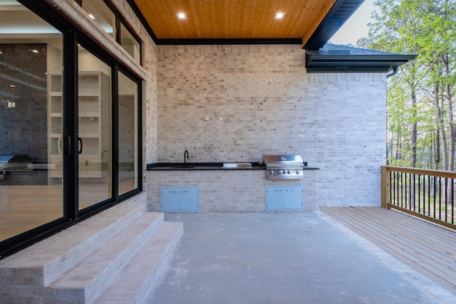 221 Abington Cir, Little Rock, AR 72223 - view of patio with a grill, an outdoor kitchen, a sink, and a deck