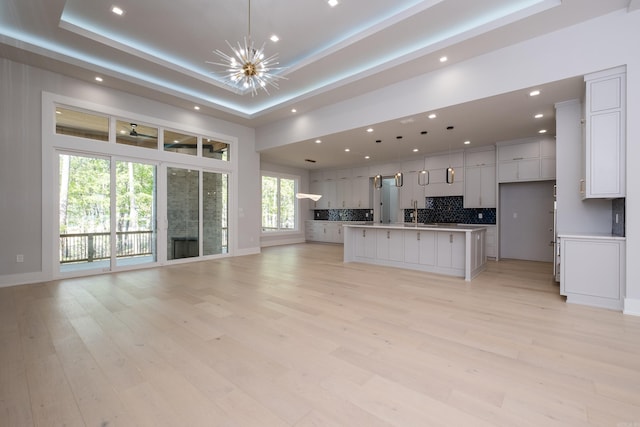 221 Abington Cir, Little Rock, AR 72223 - kitchen featuring open floor plan, tasteful backsplash, an inviting chandelier, and recessed lighting