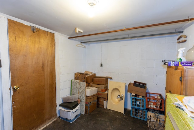 finished basement featuring concrete block wall