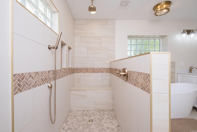 104 Dickson Dr, Little Rock, AR 72207 - bathroom with visible vents, a tile shower, and a freestanding tub