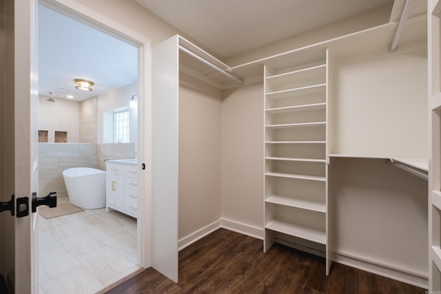 104 Dickson Dr, Little Rock, AR 72207 - spacious closet with dark wood-style flooring
