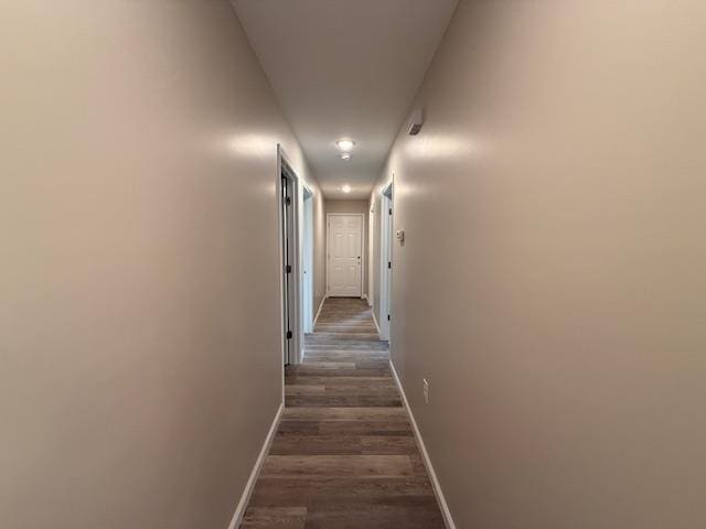 615 N Pruett, Paragould, AR 72450 - hallway with baseboards and dark wood-style floors