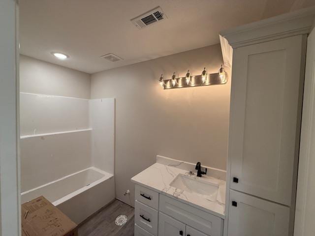 615 N Pruett, Paragould, AR 72450 - full bath featuring vanity, visible vents, and wood finished floors