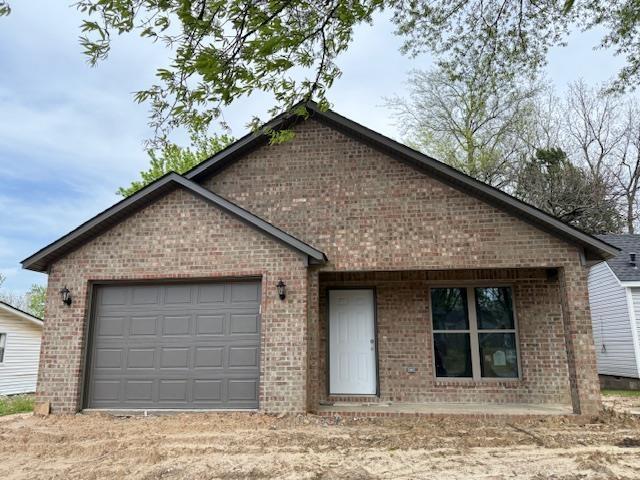 615 N Pruett, Paragould, AR 72450 - single story home featuring brick siding and a garage