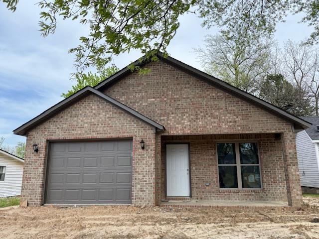 615 N Pruett, Paragould, AR 72450 - single story home featuring brick siding and a garage