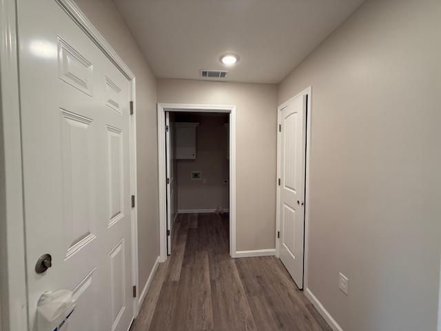 615 N Pruett, Paragould, AR 72450 - hall with baseboards, visible vents, and wood finished floors