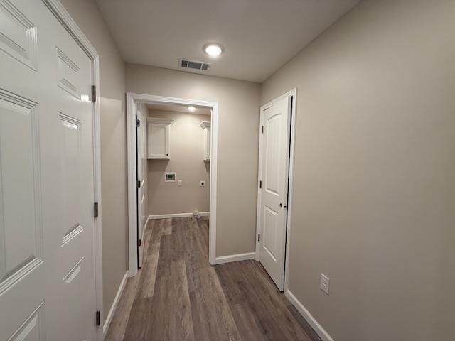 615 N Pruett, Paragould, AR 72450 - corridor featuring visible vents, dark wood-style flooring, and baseboards