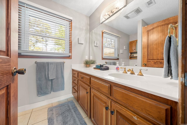 166 Heatherwood, Hot Springs, AR 71913 - bathroom with a textured ceiling, vanity, tile patterned flooring, and visible vents
