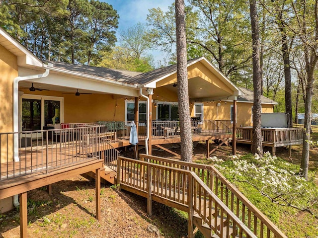 166 Heatherwood, Hot Springs, AR 71913 - back of property with stucco siding, a wooden deck, and a ceiling fan