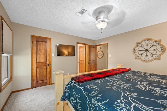 166 Heatherwood, Hot Springs, AR 71913 - carpeted bedroom featuring a textured ceiling, baseboards, a ceiling fan, and visible vents