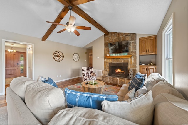 166 Heatherwood, Hot Springs, AR 71913 - living room featuring a stone fireplace, baseboards, wood finished floors, and lofted ceiling with beams