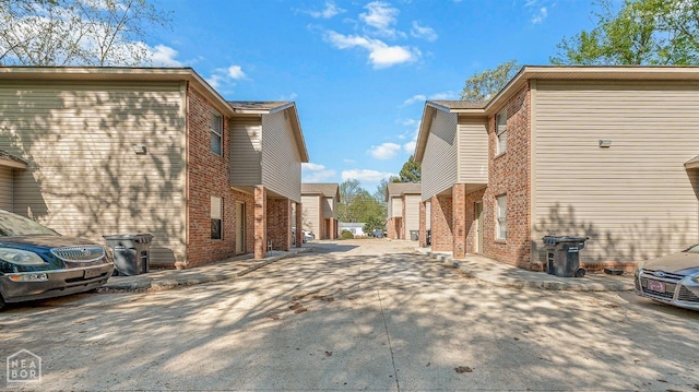 1104 Cartwright, Jonesboro, AR 72401 - view of side of property featuring concrete driveway and brick siding