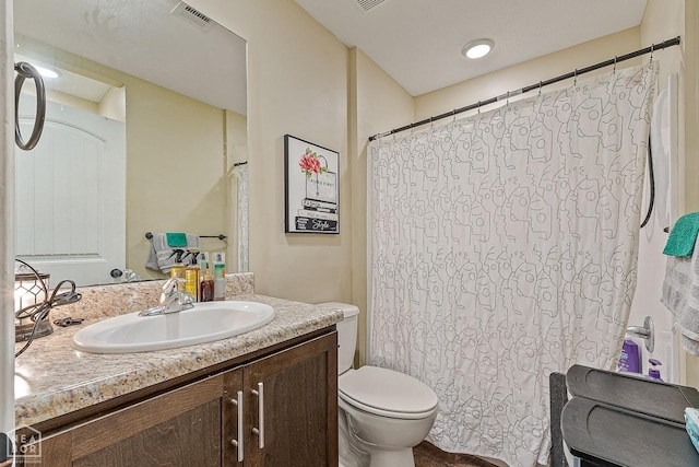 1104 Cartwright, Jonesboro, AR 72401 - bathroom featuring vanity, visible vents, a shower with curtain, and toilet