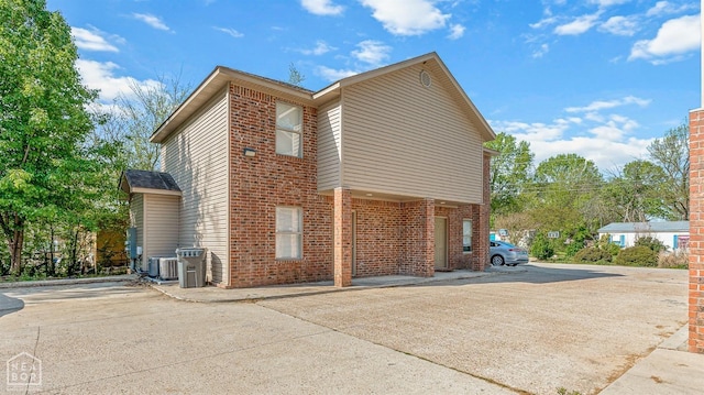 1104 Cartwright, Jonesboro, AR 72401 - view of home's exterior featuring brick siding and central air condition unit