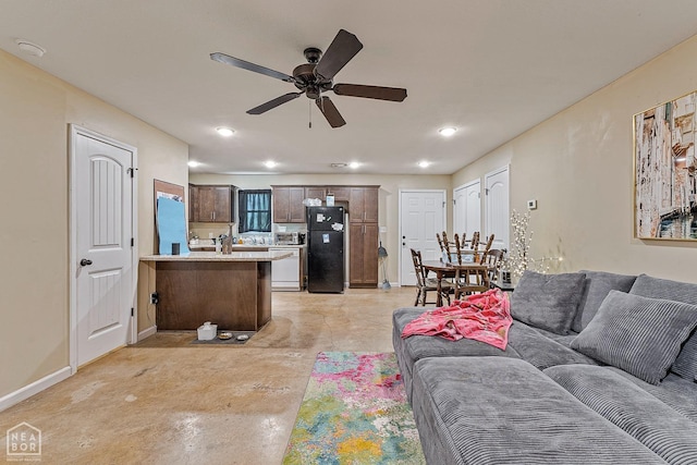 1104 Cartwright, Jonesboro, AR 72401 - living area featuring concrete flooring, baseboards, a ceiling fan, and recessed lighting