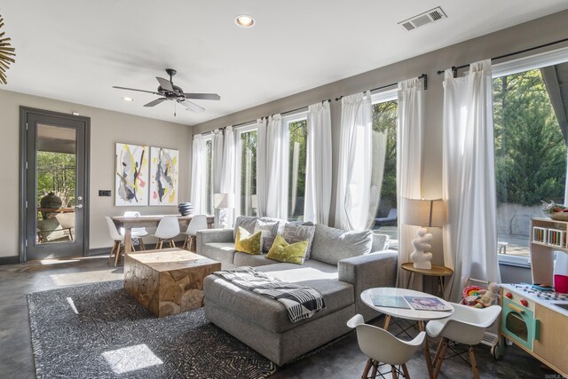 sunroom / solarium featuring plenty of natural light and visible vents